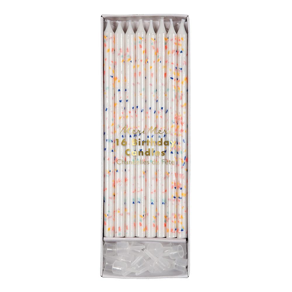 Velas largas blancas con manchas multicolor