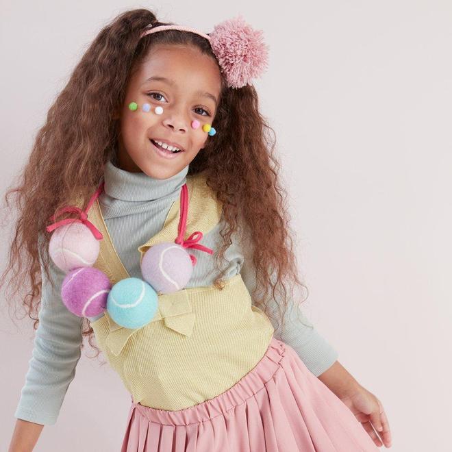 Cintillo con pompón rosado