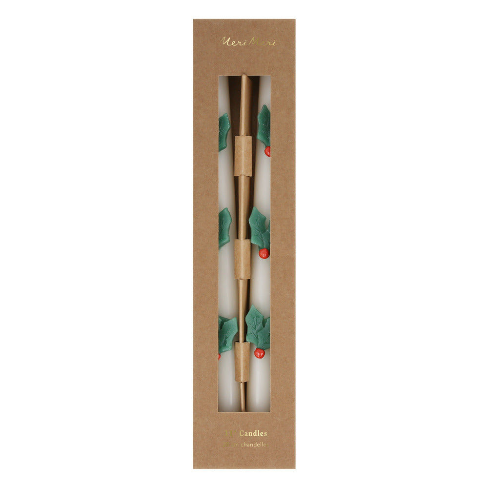 Velas de mesa con hojas de muérdago