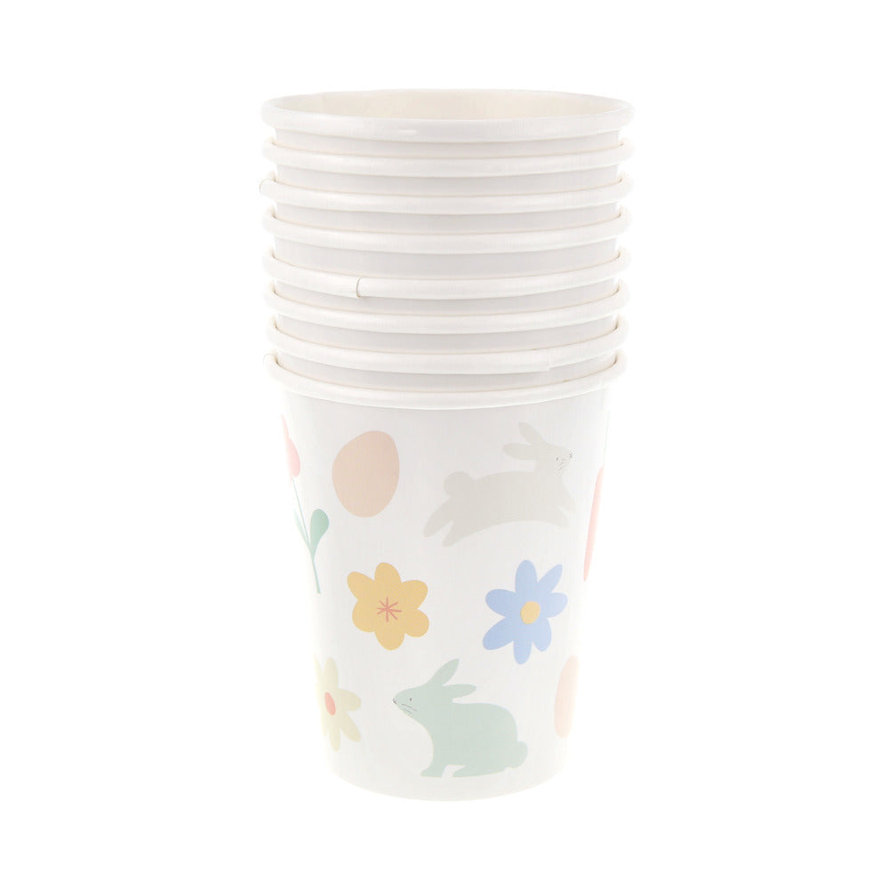 Vasos íconos de Pascua y flores