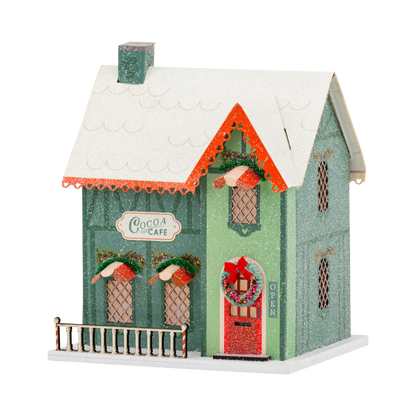 Casa aldea de Navidad iluminada - Cocoa Cafe
