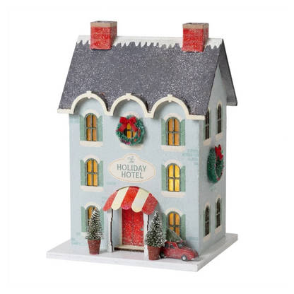 Casa aldea de Navidad iluminada - Holiday Hotel